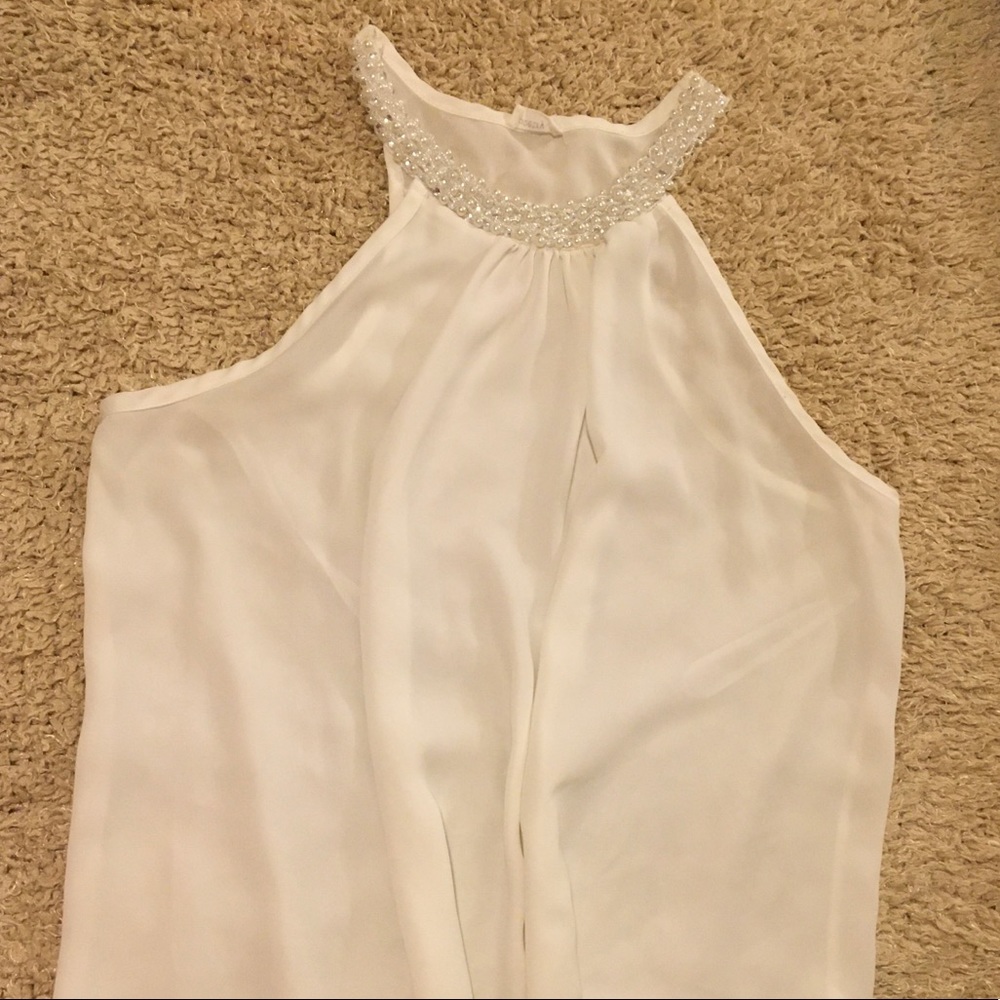 White pearled blouse
